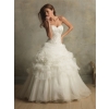 Romantic ball gown with a strapless, ruched bodice. The lovely caught-up skirt is accented with feathers, flowers, and crystals. wedding dresses